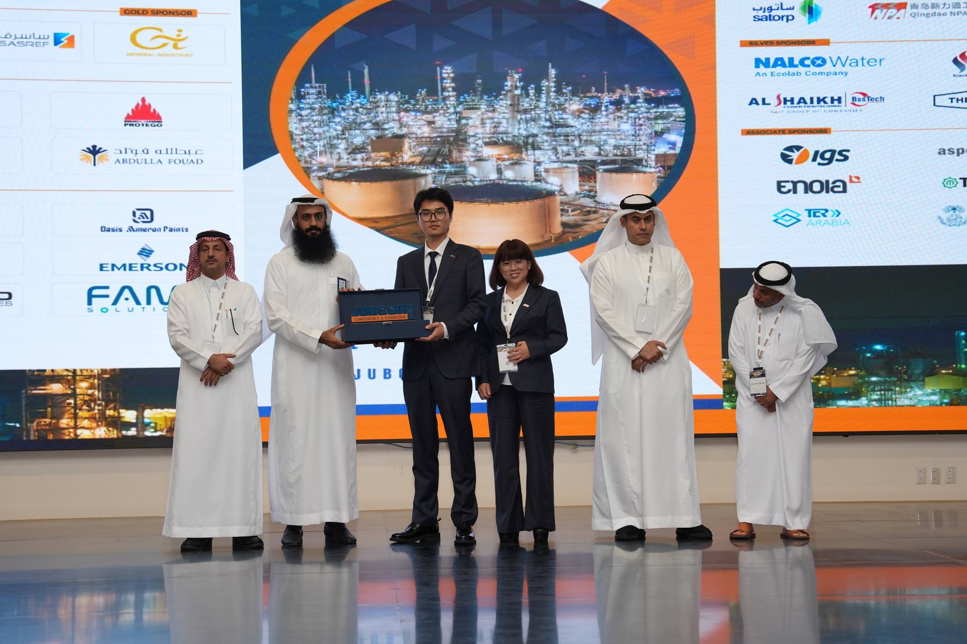 Shield presentation to guests on stage
