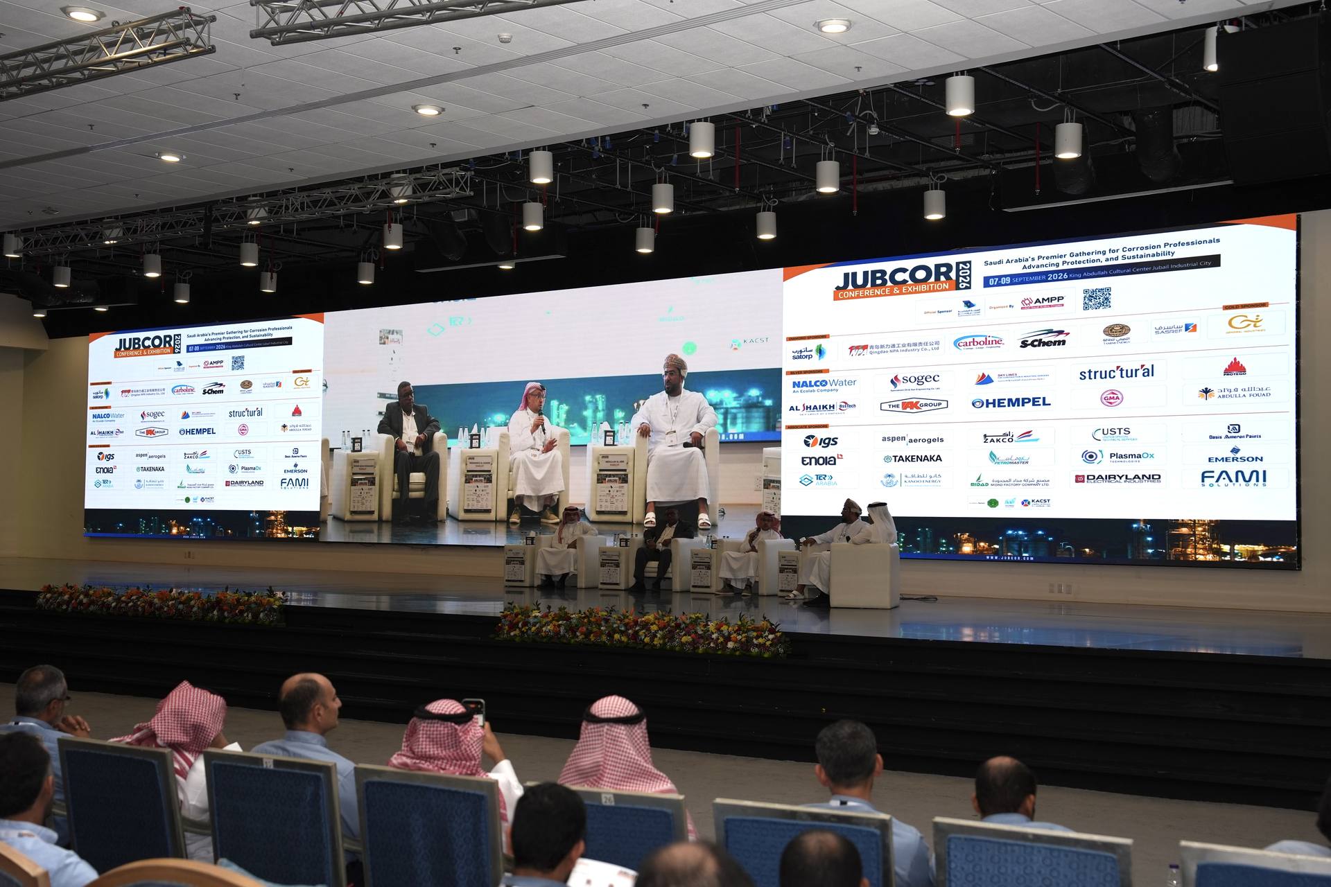 Conference hall with panel discussion on stage