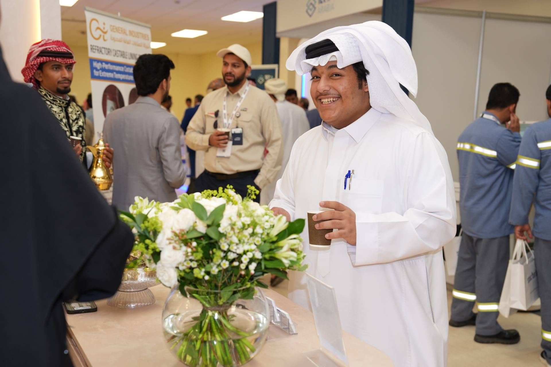 Attendee enjoying coffee at the exhibition