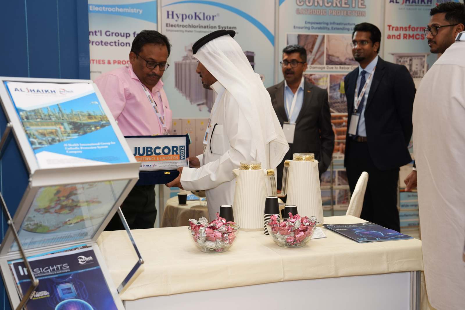 Sponsor plaque presentation at the Al Shaikh BssTech booth