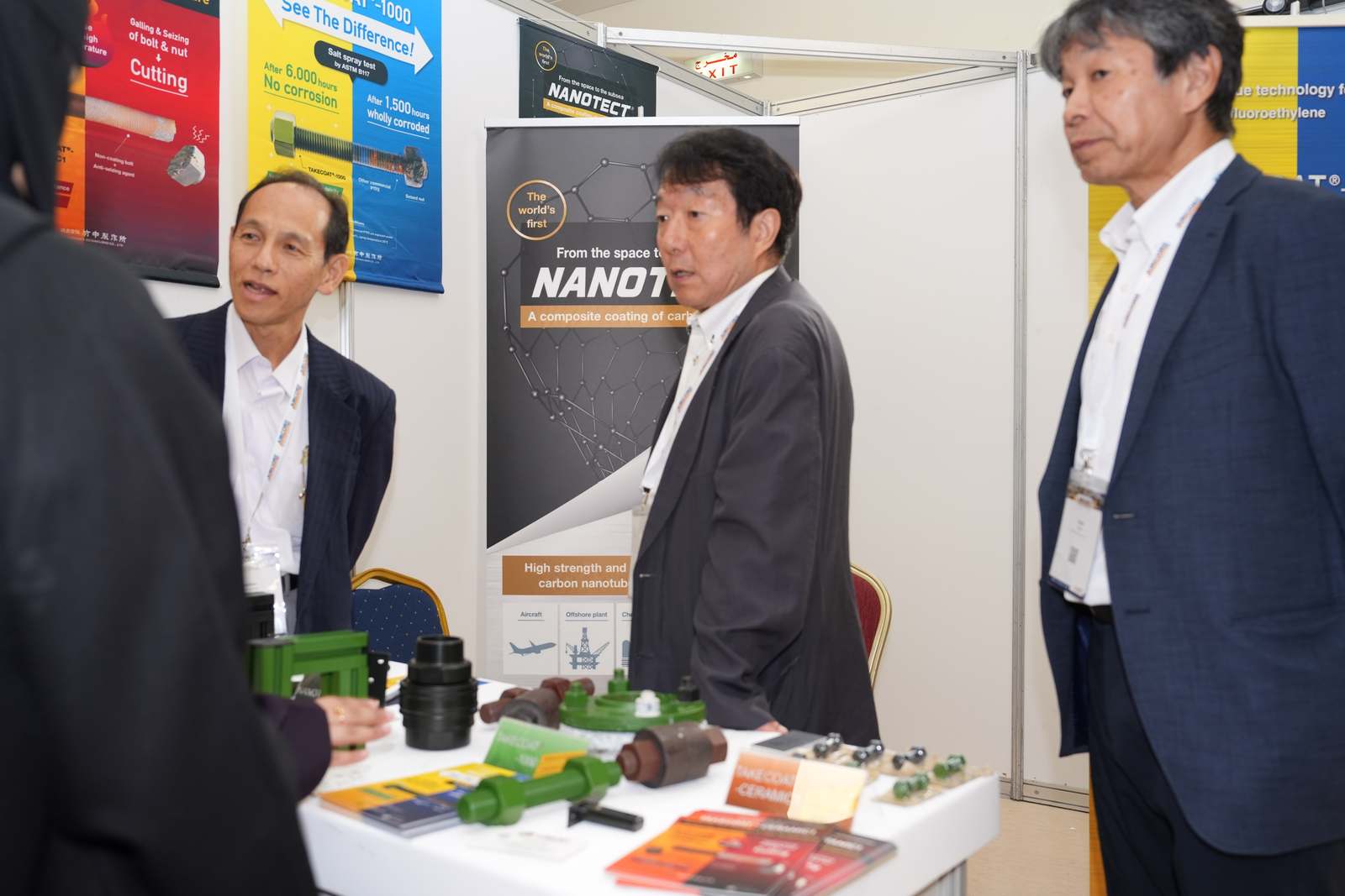 Exhibitor presenting Takenaka coating samples