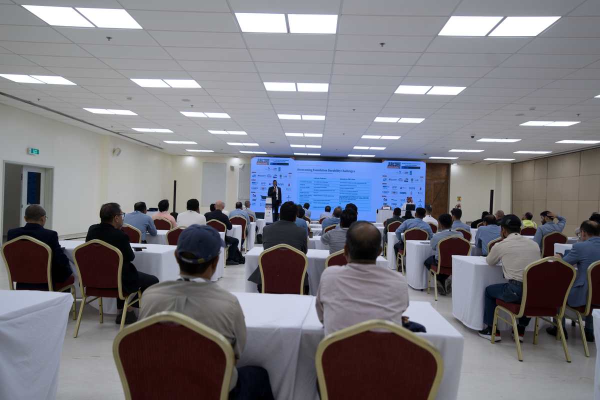 Audience attending a technical presentation on foundation durability
