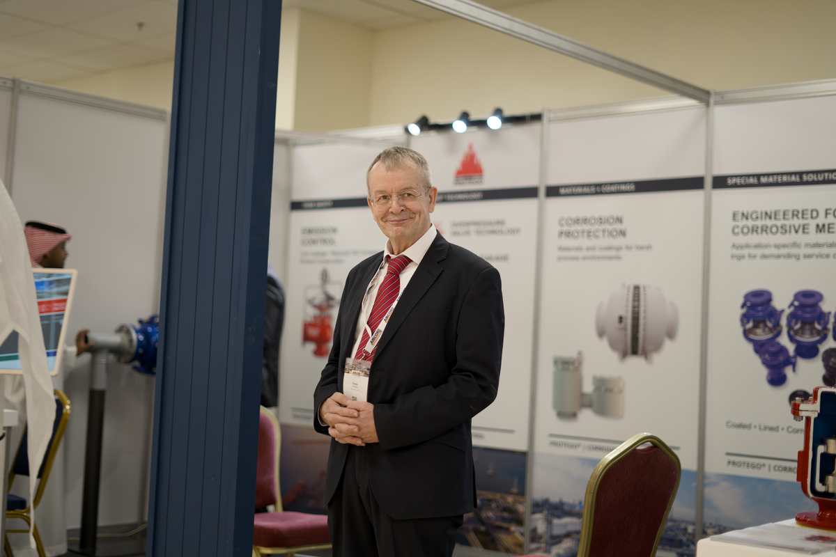 Exhibitor representative standing at the Protego booth