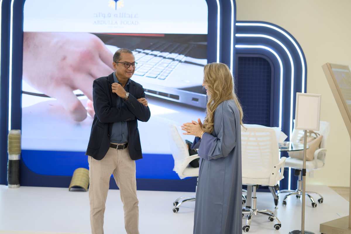 Exhibitors in discussion at the Abdulla Fouad booth