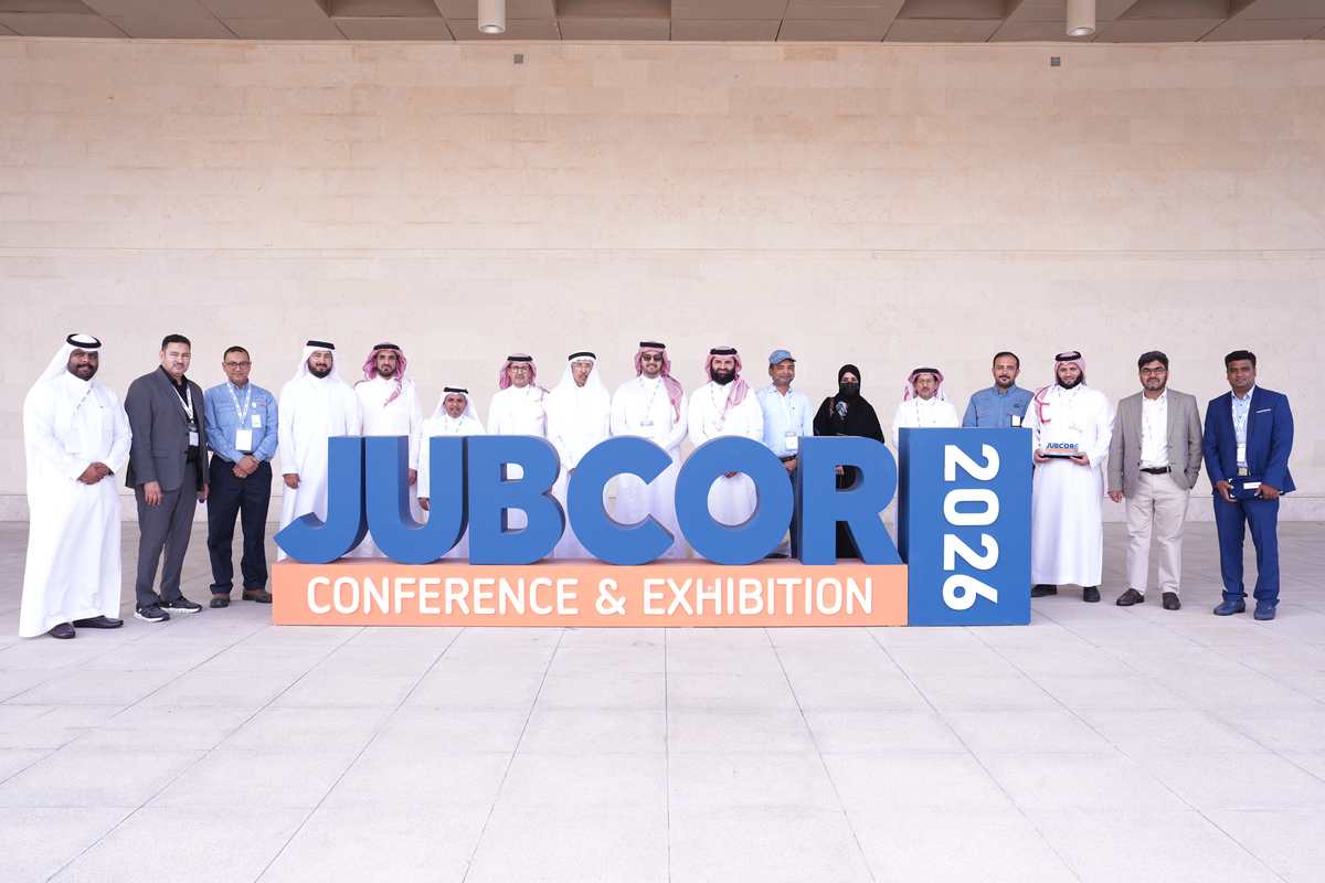 Delegation group photo at the Jubcor 2026 conference sign
